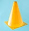 Orange cone, road barrier isolated on a blue background
