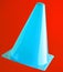 Orange cone, road barrier isolated on red background