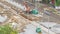 Orange construction telescopic mobile crane unloading tram rails timelapse.