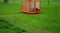 Orange container for lawnmower clippings. waste is poured from the bin directly into the mesh box. where it is then taken by the g