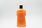 Orange cosmetic bottle isolated