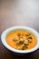 Orange creamy soup with croutons