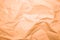 Orange crumpled paper texture background