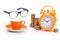 orange cup and alarm clock, coins and glasses