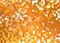 Orange Digitaly background with pixels over bright backlight.