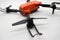 Orange drone with camera
