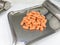 Orange drug tabs in counting tray aluminium