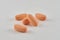 Orange drugs on light background