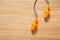 orange earplug for protection noise for safety on wood background