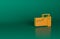 Orange Electrical measuring instrument icon isolated on green background. Analog devices. Measuring device laboratory