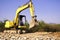 Orange excavator at construction site