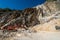 Orange Excavator in a Marble Quarry - Apuan Alps Tuscany Italy