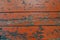 Orange fence of wooden planks