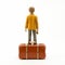 Orange Figure On Brown Suitcase: Kishin Shinoyama Style