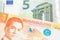 Orange Filipino money close up with money from Europe