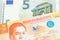 Orange Filipino money close up with money from Europe