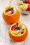 Orange filled with fruit salad