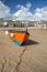 Orange fishing boat on beach, St Ives, Cornwall -3