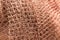 Orange fishnet texture. Close up pattern