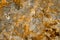 Orange flake Stone wall background texture