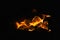 Orange flame fire on black background. Dramatic flames flickering against the darkness. Fire and heat element, danger, intensity,