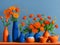 Orange flowers and a blue background creates a visually striking display where the warmth of the flowers harmonizes.