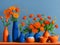 Orange flowers and a blue background creates a visually striking display where the warmth of the flowers harmonizes with the