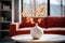 Orange flowers on branches in a white vase on the coffee table in the living room