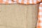 Orange folded checkered rural tablecloth over canvas - frame