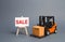 Orange forklift truck carries a cardboard box and a stand with a word sale. growth of sales. big discounts on goods