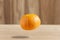 orange fruit floating in the air