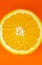 Orange fruit on orange background.  Minimalism, original beautiful photo