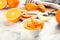 Orange fruit peels on white marble table