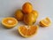 orange fruit in pieces, whole and half