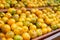 Orange fruits soiled organic stacked on wood crate in grocery