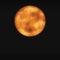 Orange full moon in dark black sky background