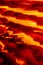 Orange futuristic vertical burning fire abstract hi tech concept background with wavy geomentrical glowing elements.