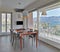 Orange glass dining table in hte modern kitchen