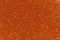 Orange glitter texture christmas background. Bright golden glitter texture.