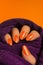 Orange glittered nails manicure