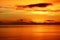 Orange glow over calm sea at sunset