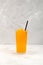 Orange Granizado in tall clear glass. Spanish Refreshing summer iced drink. Slushie fruit drink. Sweet Shaved ice