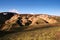 Orange and green hills on a sunny day in Landmannalaugar National Park, Iceland