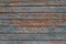 Orange and grey old wooden texture background. Scratched weathered gray wooden wall