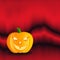 Orange Halloween pumpkin against spooky background