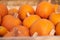 Orange halloween pumpkins on stack of hay or straw in sunny day, fall display