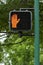 Orange hand don\'t walk sign