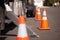 Orange Hazard Cones and Utility Truck in Street