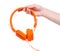 Orange headphones sound in hand