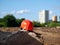 Orange helmet on a background of  vacant lot